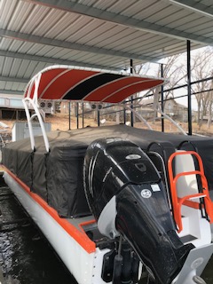 A speedboat with an orange roof