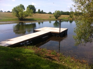 A T-shaped wooden swim dock
