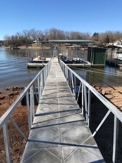 A sturdy metal walkway leading to a dock